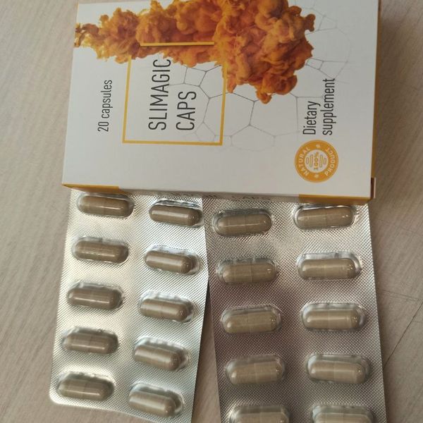 Škatla Slimagic Caps z oranžnim vzorcem in dva pretisna omota kapsul